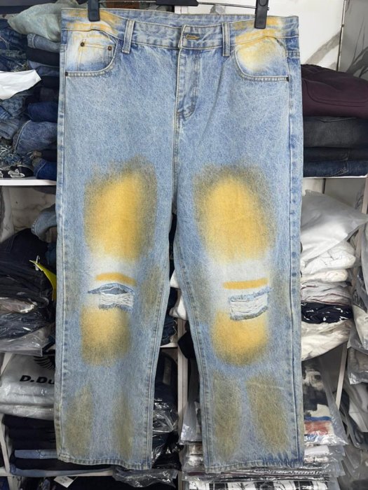 Distressed Light Wash Jeans with Yellow Tint Detailing