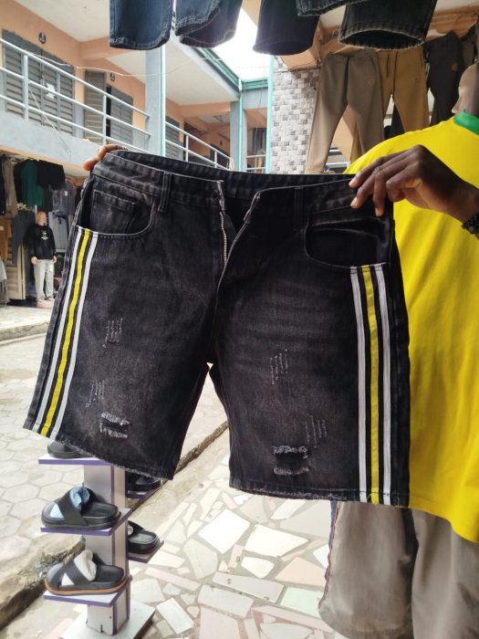 Distressed Black Denim Shorts with Yellow and White Side Stripes