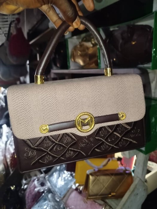 Two-Tone Structured Handbag with Gold Logo and Protective Wrap