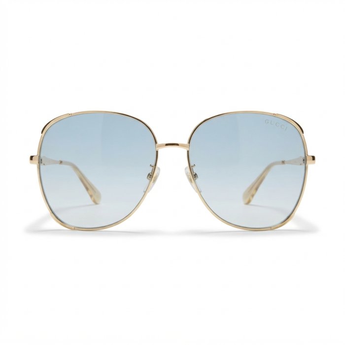 Gucci Oversized Round Gold-Tone Sunglasses with Light Blue Gradient Lenses[cite: 14]